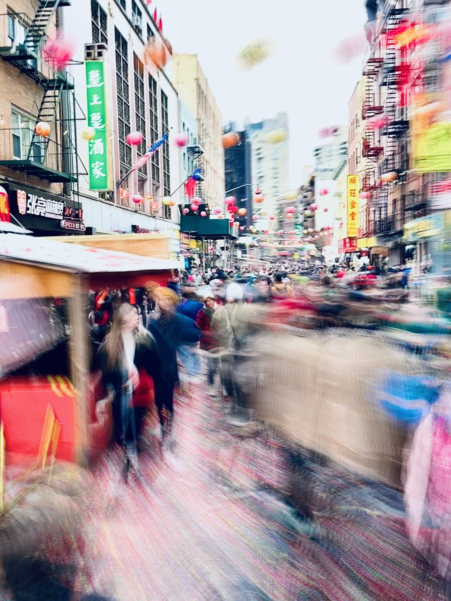 A busy city street in downtown Chinatown, New York City captured by Tony Guinn